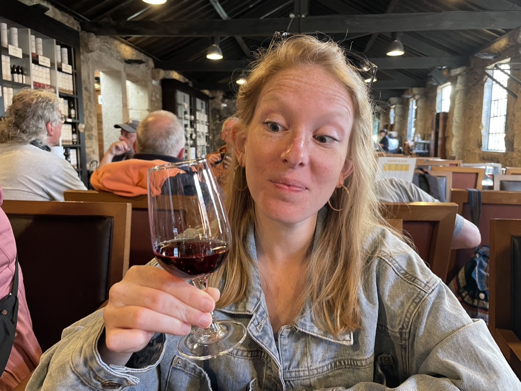 Aimee drinking port wine at the Burmester Cellars in Porto