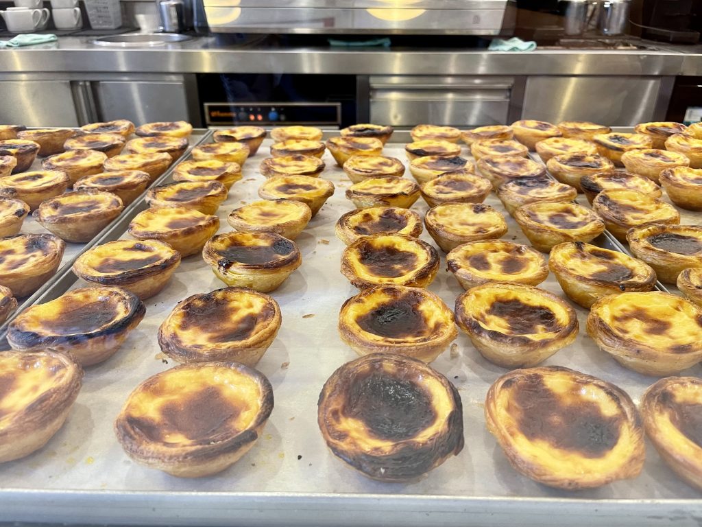Pasteis de nata in a bakery window in Porto, Portugal