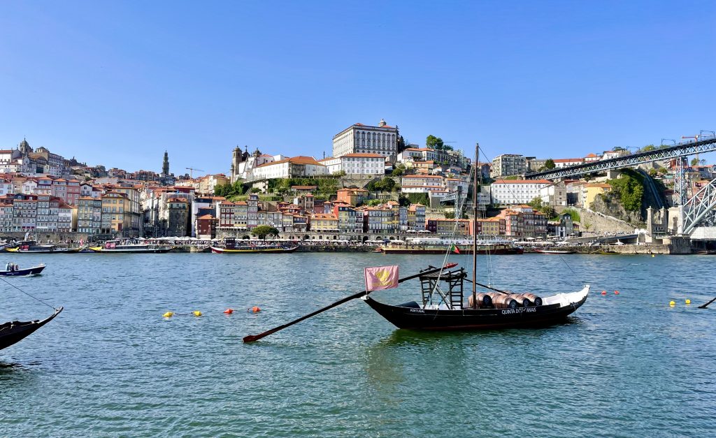 A traditional rabelo boat floating on the Douro River in Porto