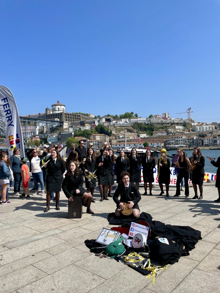 A female Portuguese tuna performing on Porto's Cais da Ribeira