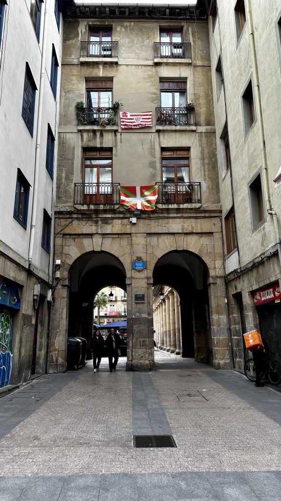 A Basque Country flag hanging near the Plaza Nueva in Bilbao, Spain