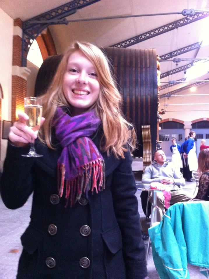 A woman drinking Champagne in Reims