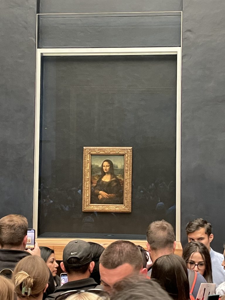The Mona Lisa surrounded by people